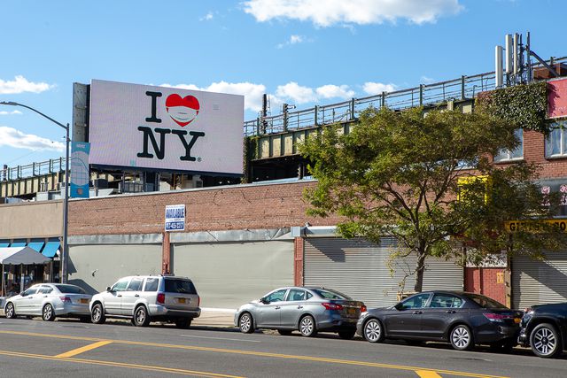 I Love NY billboard with mask on the heart